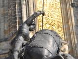 St. George and the Dragon statue with St. Vitus Cathedral in the background – on the yard of the Prague castle 